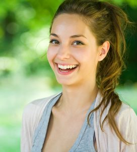 'woman smiling post-extraction'